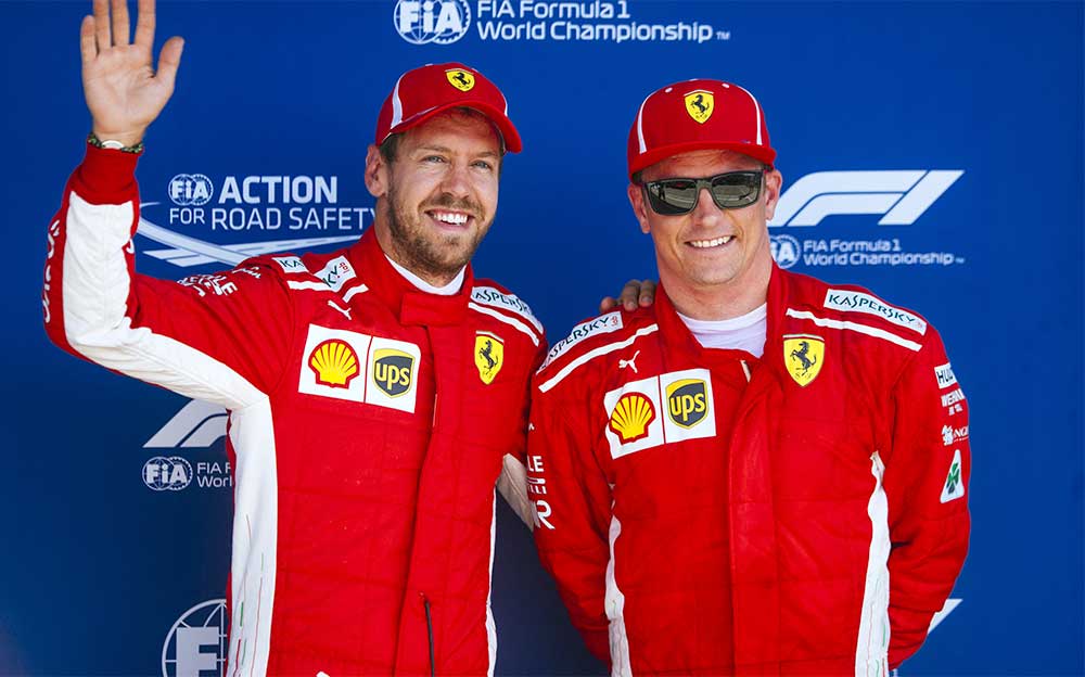 F1イギリスGP予選を終えて笑顔を見せるフェラーリのセバスチャン・ベッテルとキミ・ライコネン