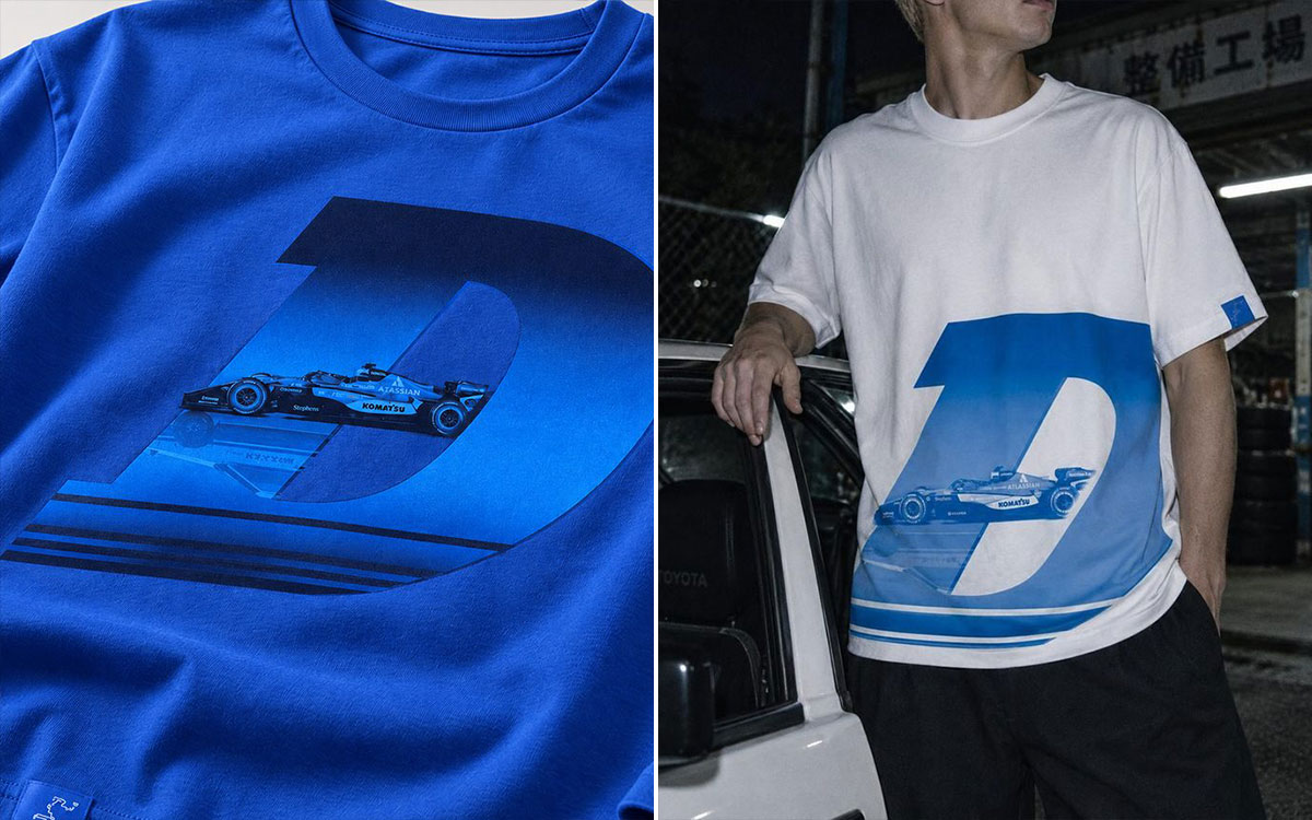 ウィリアムズF1チームと『頭文字D』のコラボレーションで登場した、ウィリアムズのF1マシンと「D」のグラフィックを大胆にあしらったブルーとホワイトのTシャツ